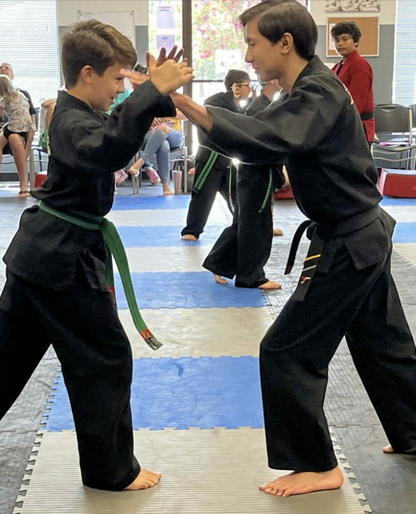 Martial arts builds focus, confidence, respect and discipline in kids for back to school. 